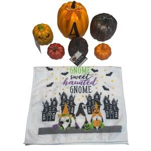 Halloween Decorations Assortment Of Pumpkins, Jack-o-Lanterns, And Kitchen Towel